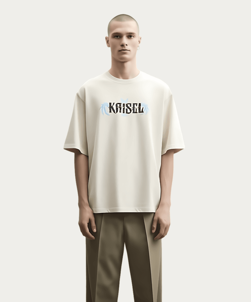 A person with a shaved head stands against a plain background, wearing a Solo Leveling Kaisel Dragon T-Shirt - Beige and a stylized wing and spine design on the back, paired with khaki pants.
