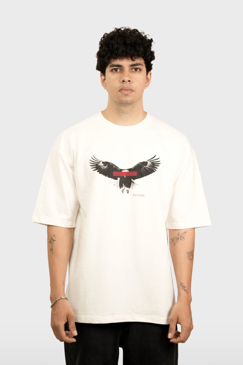 Model wearing the Yeefoo Defend Eagle Tee, a cream Animal Graphic T-Shirt. Model in a Yeefoo oversized t-shirt. The official storefront for the premium Indian streetwear collection.