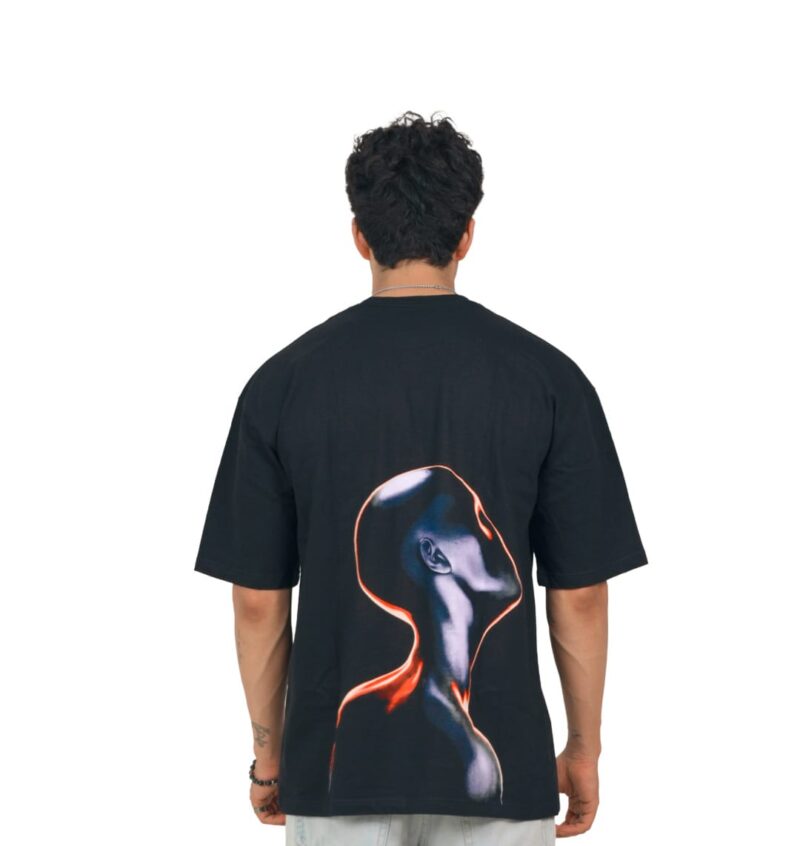 Back view of the Futuristic Graphic T-Shirt, showing the metallic android artwork from yeefoo. Model in a Yeefoo oversized t-shirt. The official storefront for the premium Indian streetwear collection.