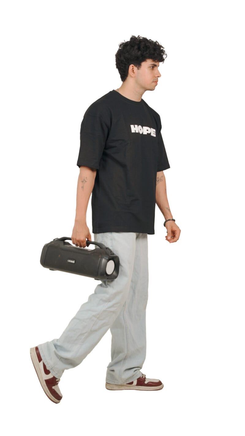 Lifestyle photo of a model wearing the black Future Hope Tee
