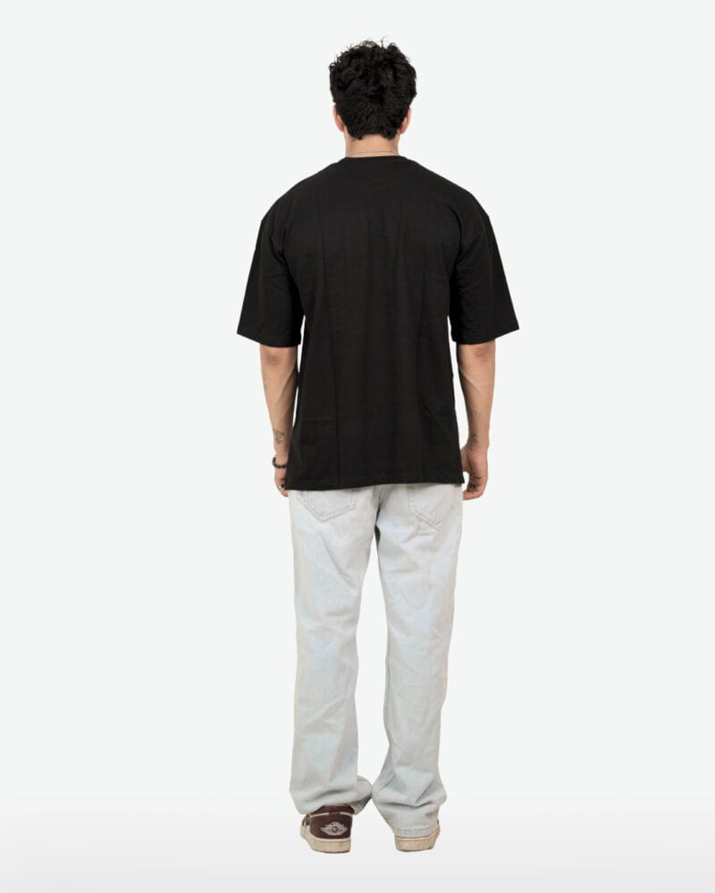 Back view of the oversized Hope Butterfly Tee in black, showing the clean back