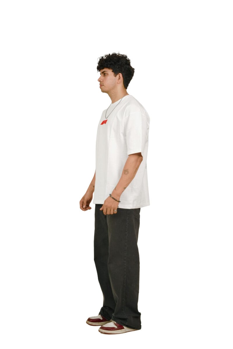 Side profile of a model wearing the oversized Vintage Racing T-Shirt.