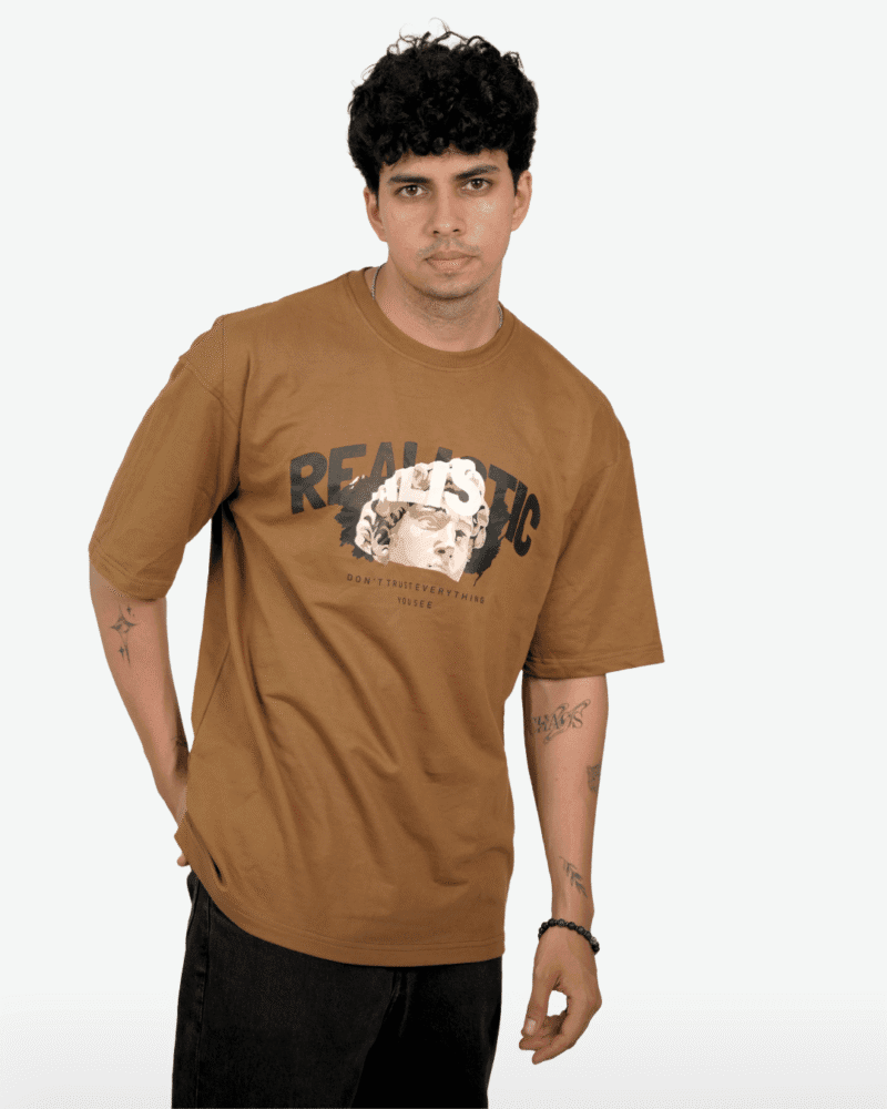 Angled view of the model wearing the mocha brown Realistic Statue Tee.