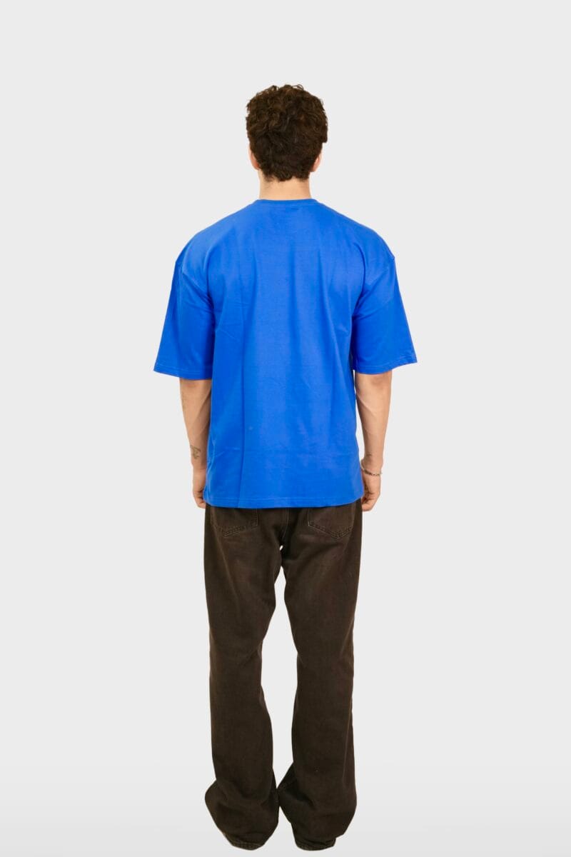 Model wearing the Yeefoo Look In My Eyes Tee, a royal blue Typographic T-Shirt.